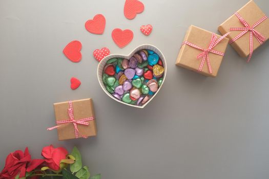 heart shape gift , rose flower on table ,