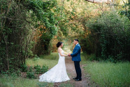 A couple in love a guy and a girl on a walk in the forest belt