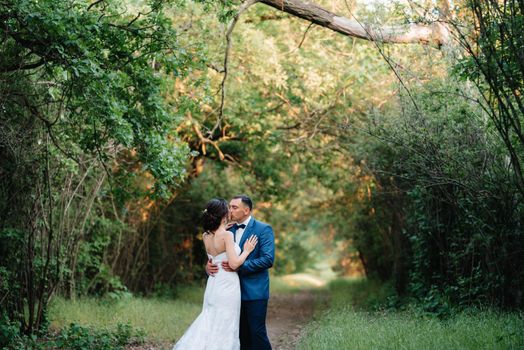 A couple in love a guy and a girl on a walk in the forest belt