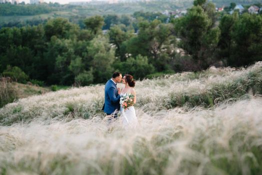 A couple in love a guy and a girl on a walk in the forest belt