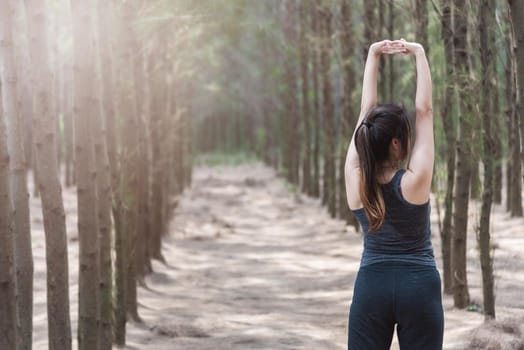 Beautiful young woman lifestyle fresh air happy relaxing in forest park