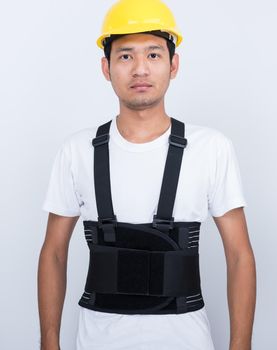 Worker Man stand wearing back support belt body protect posture