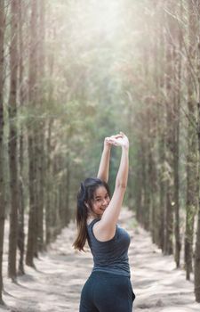 Portrait young woman lifestyle enjoying fresh air happy relaxing outdoors in green forest park