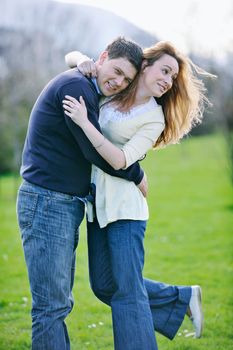 happy young couple have good time and fun outdoor at beautiful sunny day