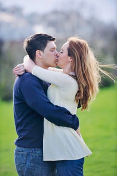 happy young couple have good time and fun outdoor at beautiful sunny day