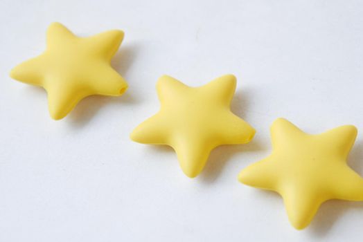 Customer review concept. Rating golden stars on blue background .