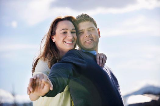 happy young couple have good time and fun outdoor at beautiful sunny day