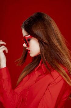 cheerful woman in a red shirt sunglasses Glamor close-up. High quality photo