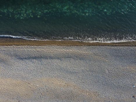 Aerial panoramic view of beautiful sunset above sea. Beautiful seascape. Sun glare, small waves on the water surface. Evening. Horizon. Nobody. No people. Copy space. Never-ending beauty of nature