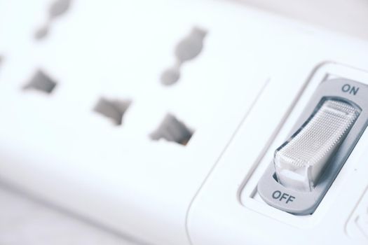 Electrical switch and plug on color background