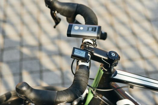 Close up shot of professional bike handlebar with equipment and accessories. Sports, extreme and active lifestyle concept