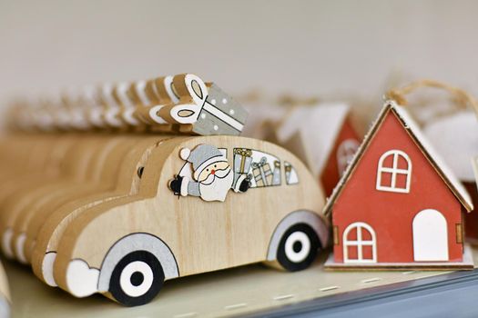 Santa Claus in a wooden car with gifts in a shop