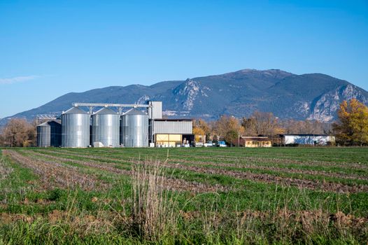 landscape with animal feed silos in an expanse in the province of Terni
