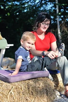 woman and child have fun outdoor at partk in nature