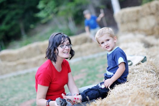 woman and child have fun outdoor at partk in nature