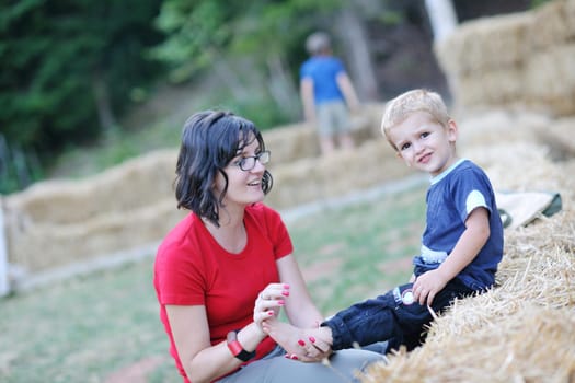 woman and child have fun outdoor at partk in nature