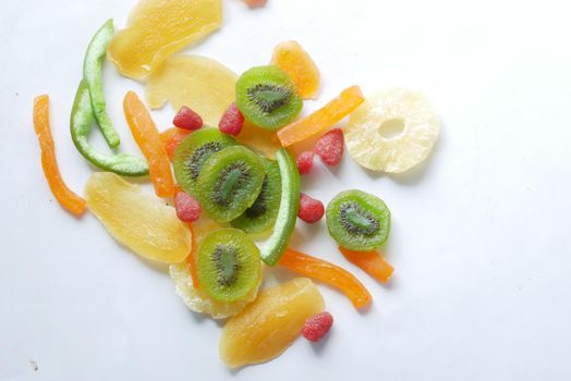 Dried fruits and berries on blue background .