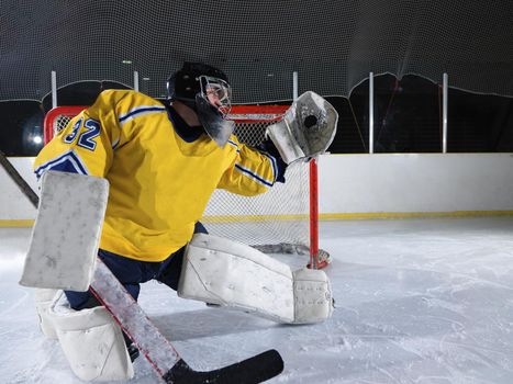 ice hockey goalkeeper  player on goal in action