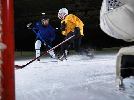 ice hockey goalkeeper  player on goal in action