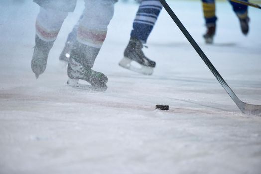 ice hockey player in action kicking with stick