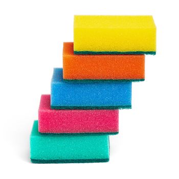 Lot of foam sponges for washing dishes and cleaning in kitchen. Beautiful pyramid of five sponges of yellow, orange, blue, pink and green colors on white background. Closeup view, vertical composition