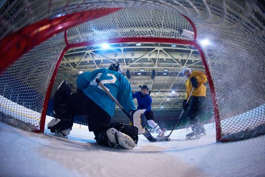 ice hockey goalkeeper  player on goal in action