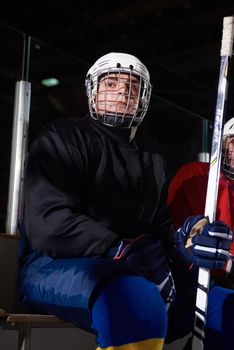 ice hockey players,  group of team friends waiting on bench to start  game