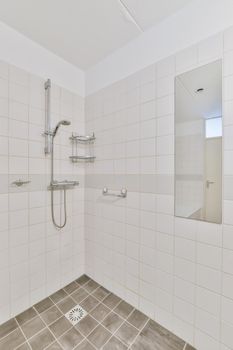 Delightfully laid brown tiled bathroom floor in a chic apartment