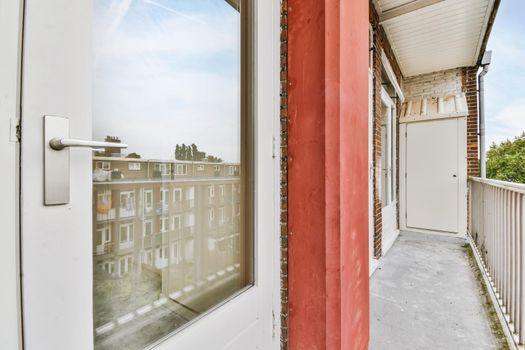 Long narrow balcony with a beautiful street view