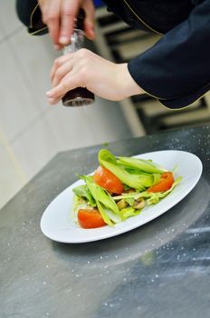 beautiful young chef woman prepare and decorating tasty food in kitchen