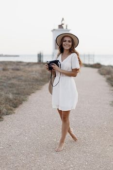 happy woman with camera outdoor. High quality photo