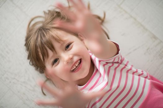 portrait of happy smiling child at home while playing