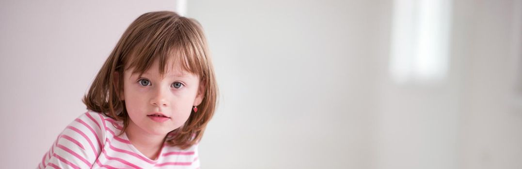 portrait of happy smiling child at home while playing