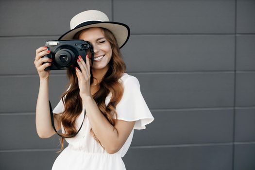 happy woman with camera outdoor. High quality photo