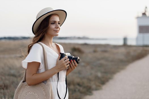 happy woman with camera outdoor. High quality photo