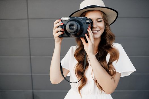 happy woman with camera outdoor. High quality photo