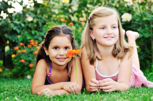 two happy young girls children  have fun outdoor in nature