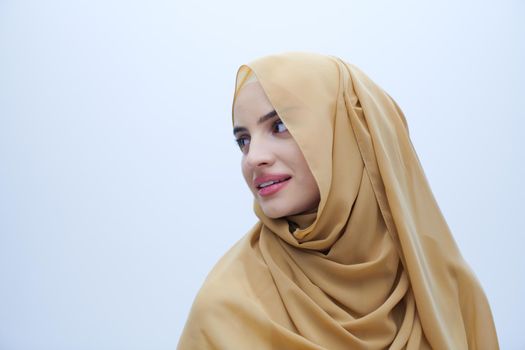 portrait of beautiful muslim woman in fashionable dress with hijab isolated on white background representing modern islam fashion and ramadan kareem concept