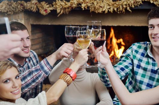 Group of happy young people drink wine  at party disco restaurant