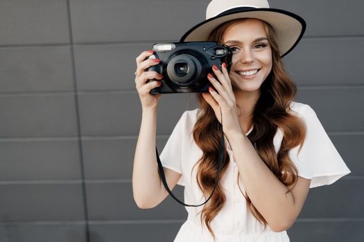 happy woman with camera outdoor. High quality photo