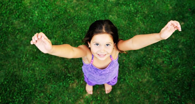 happy young girl children relax lie and have fun on grass with flower