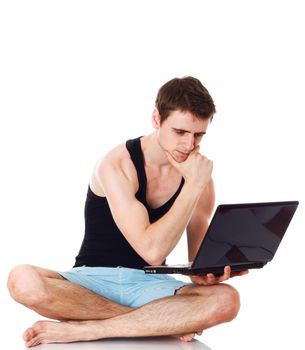 Isolated image of a young man with his laptop.