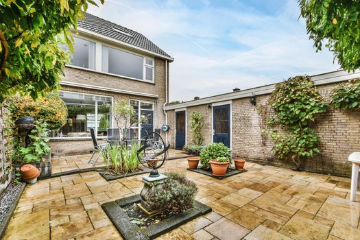 Delightfully beautiful courtyard with greenery and clearly laid cobblestones