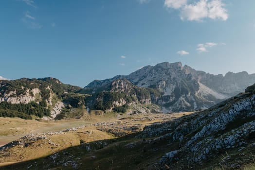 Mountain valley during sunrise. Natural summer landscape. Mountain peak green nature scenery. trail on green hill landscape.