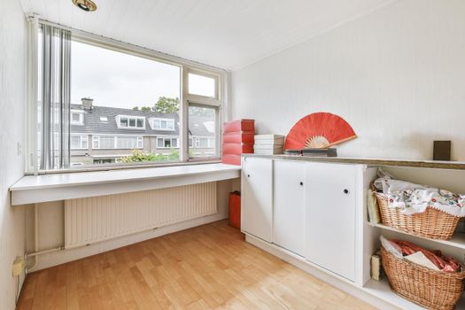 Small cozy room with a large window on the entire wall