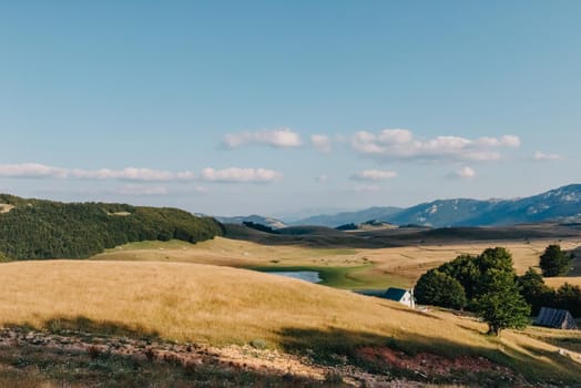 Mountain valley during sunrise. Natural summer landscape. Mountain peak green nature scenery. trail on green hill landscape.