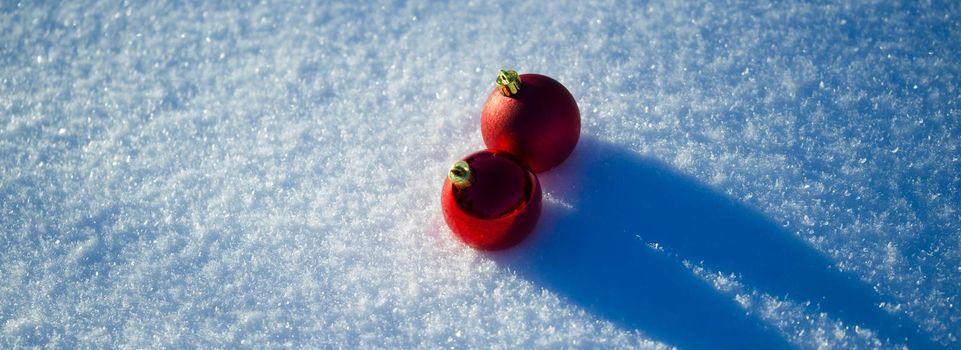 christmas balls tree decoration in fresh snow abstract background