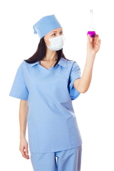 Full isolated studio picture from a young and beautiful female doctor with flask in her hand.