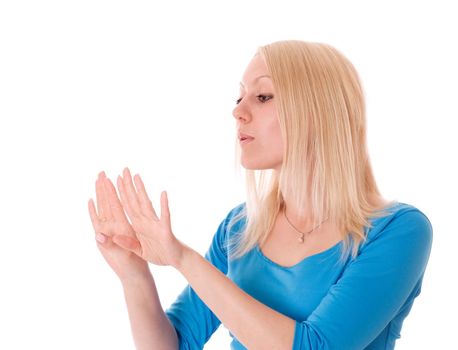 Female looking at her nails with manicure, isolatedon white.