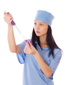 Full isolated studio picture from a young and beautiful female doctor with doser and tube in her hand.